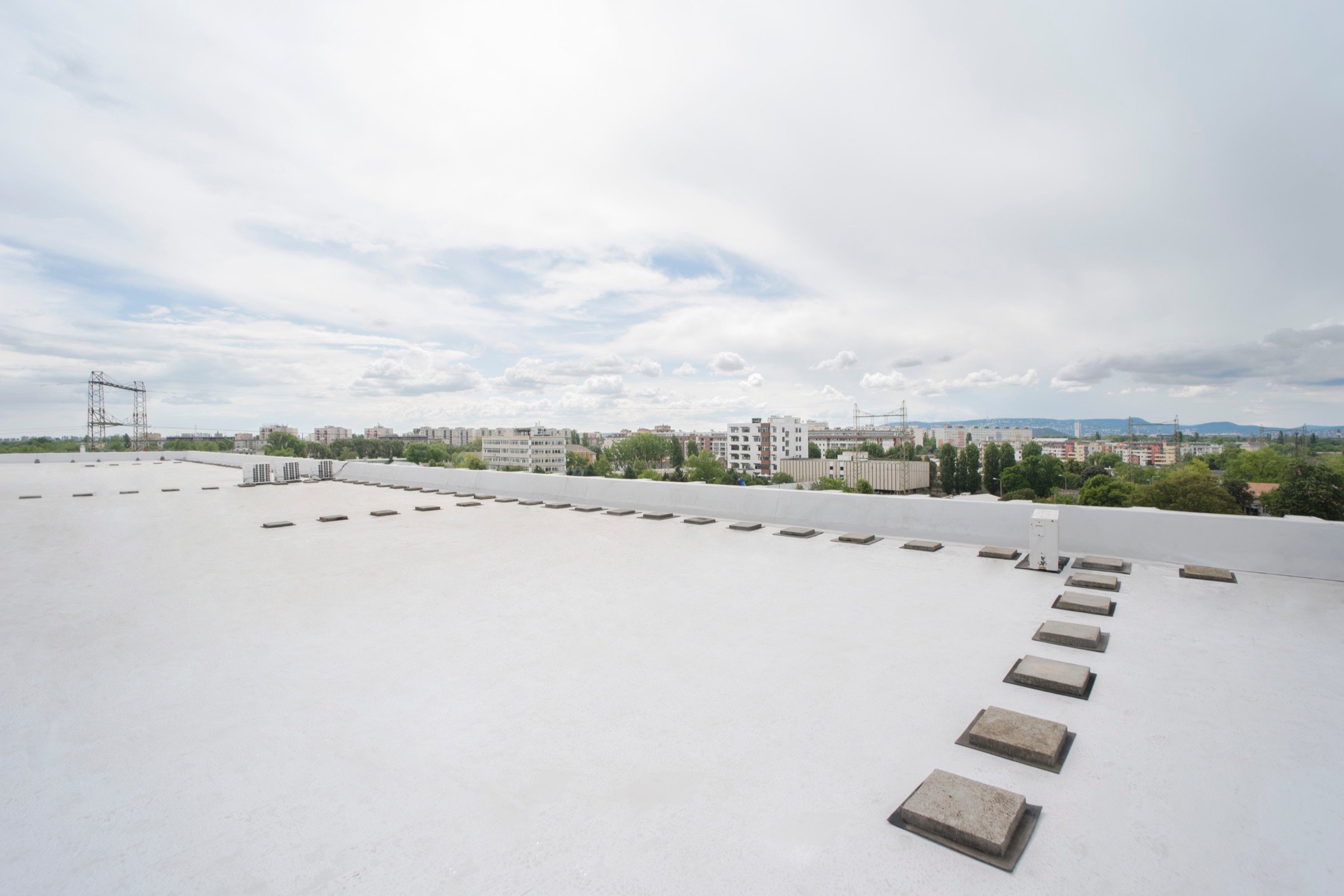Picturepool Studios rooftop — panoramic view of the Budapest cityscape with buildings, trees and distant hills